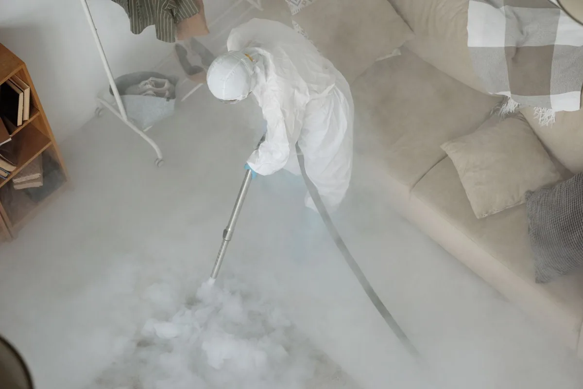 Biohazard cleanup technician in protective equipment, Vamo, FL